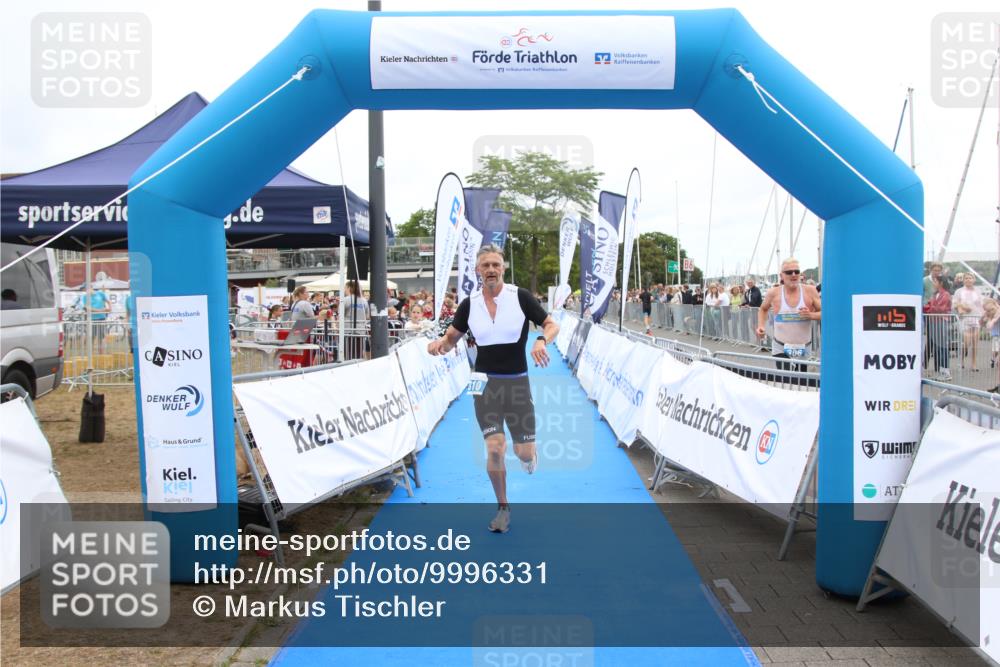 16.08.2026 - KN Förde Triathlon 2026 Markus Tischler http://msf.ph/oto/9996331 16.08.2026 11:56:49 Ziel 310, 323, 441, 310, 323, 441 meine-sportfotos.de