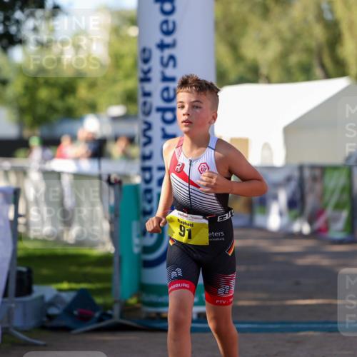 01.09.2024 - 17. Tribühne Triathlon Michael Strokosch http://msf.ph/oto/6898033 01.09.2024 09:55:22 Ziel 91 meine-sportfotos.de